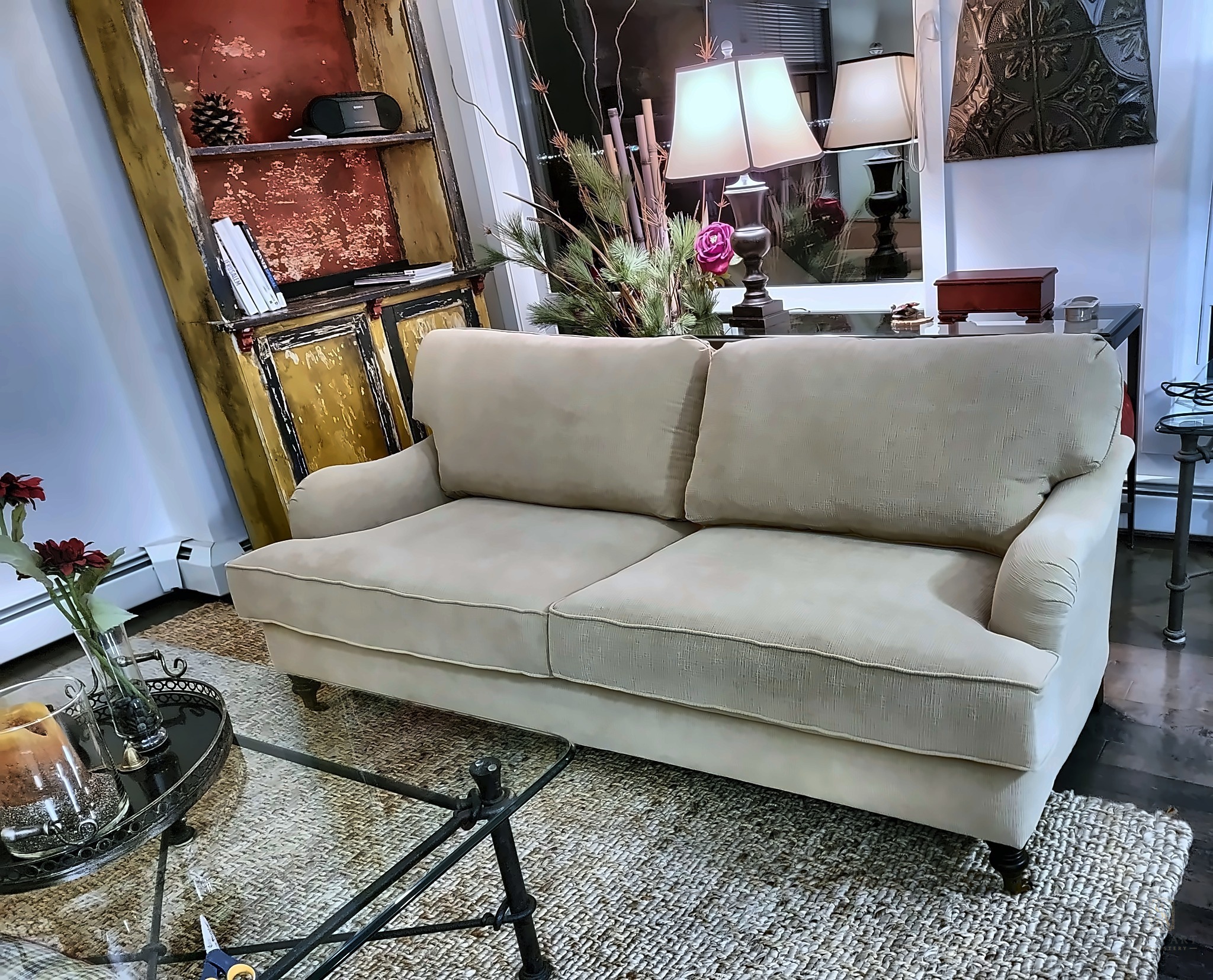 Cream English roll-arm sofa restored, styled in a living room