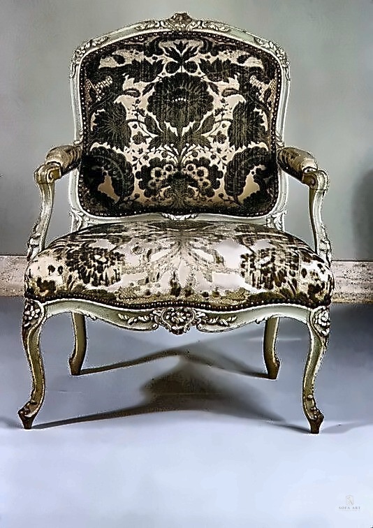 Wing chair with pattern accents and cream cushions